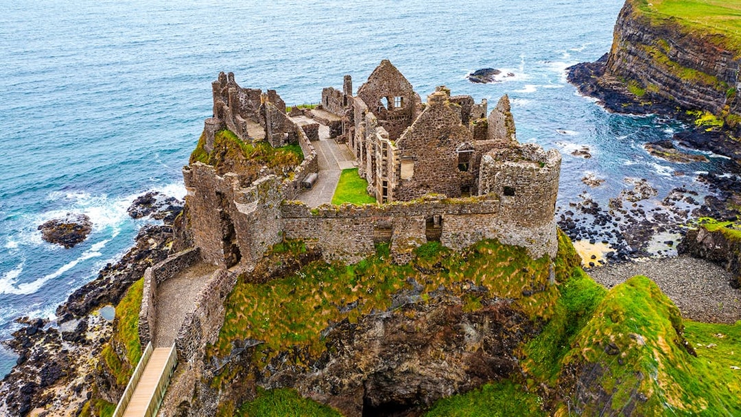 Dunluce Castle ruins on a coastal cliff in Northern Ireland.