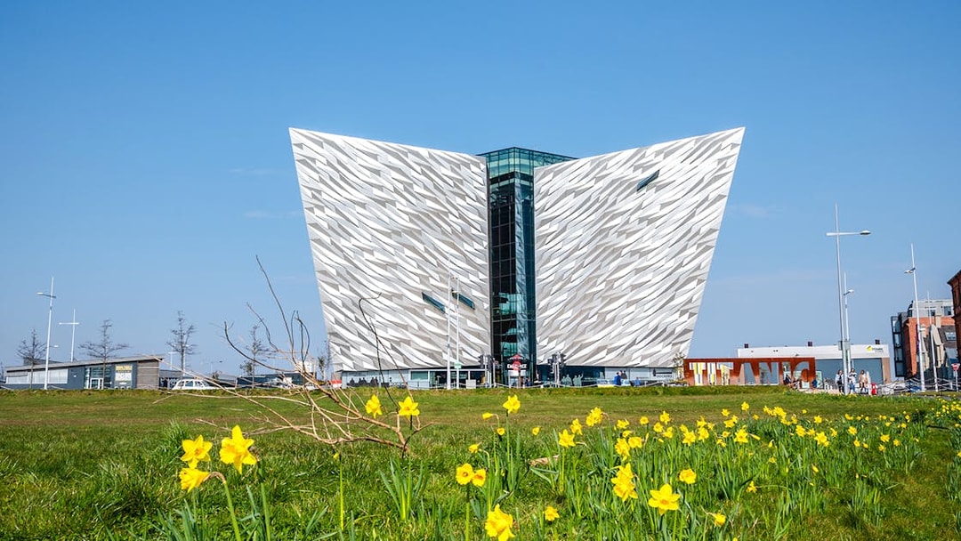 Titanic Museum facade with daffodils in Belfast, Northern Ireland.
