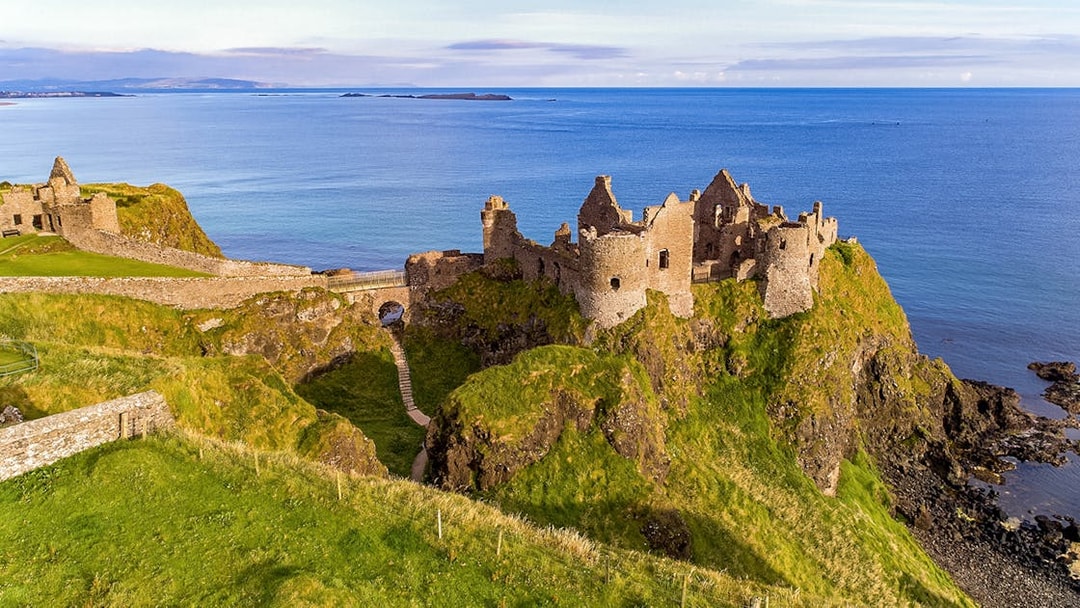 Dunluce Castle ruins on a cliff overlooking the sea, Northern Ireland, Game of Thrones tour location.