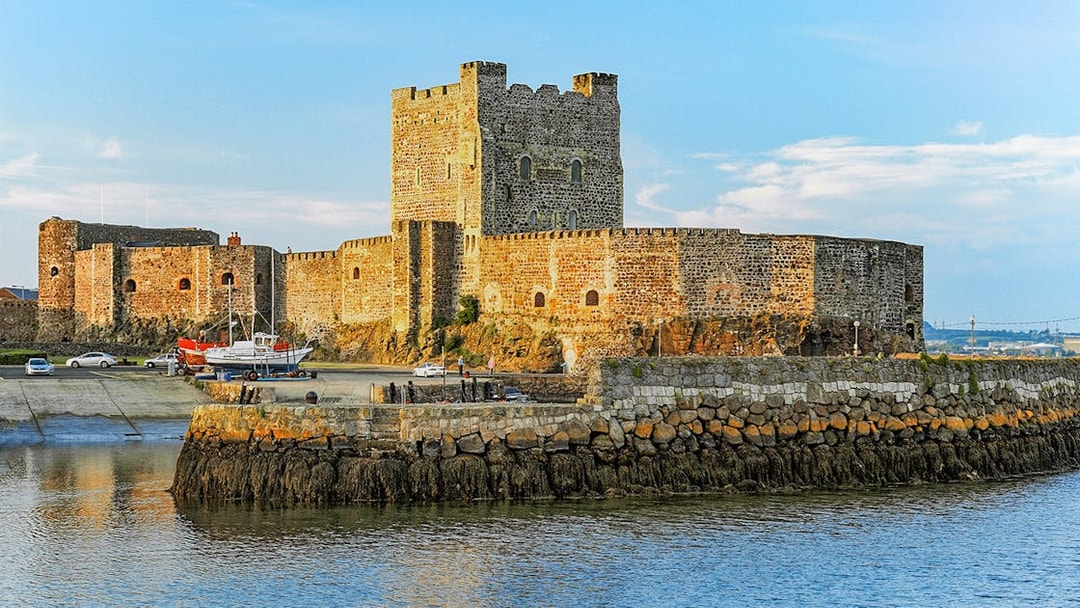 Carrickfergus Castle by the water, featured in Game of Thrones location tour.