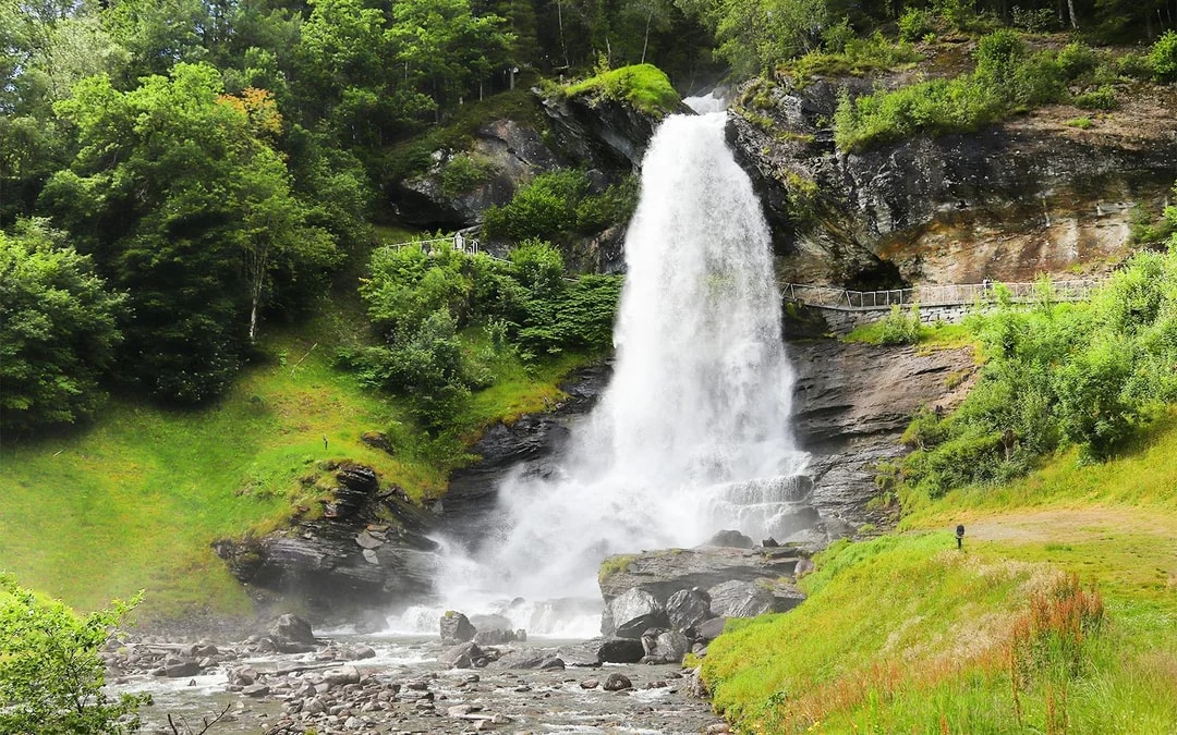 Steinsdalsfossen waterfall with walkway and cascading water in Norway.