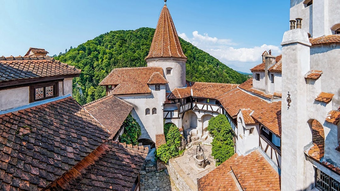 Brasov old town view with red-tiled roofs and medieval architecture during a full day trip.