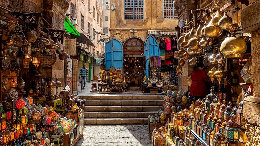 Khan El Khalili Bazaar with colorful lanterns and traditional goods in Cairo, Egypt.