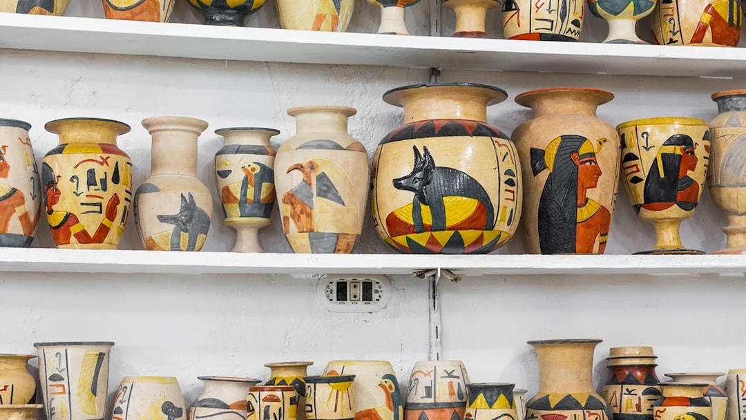 Ceramic vases with Egyptian motifs displayed at Khan El Khalili Bazaar, Cairo.