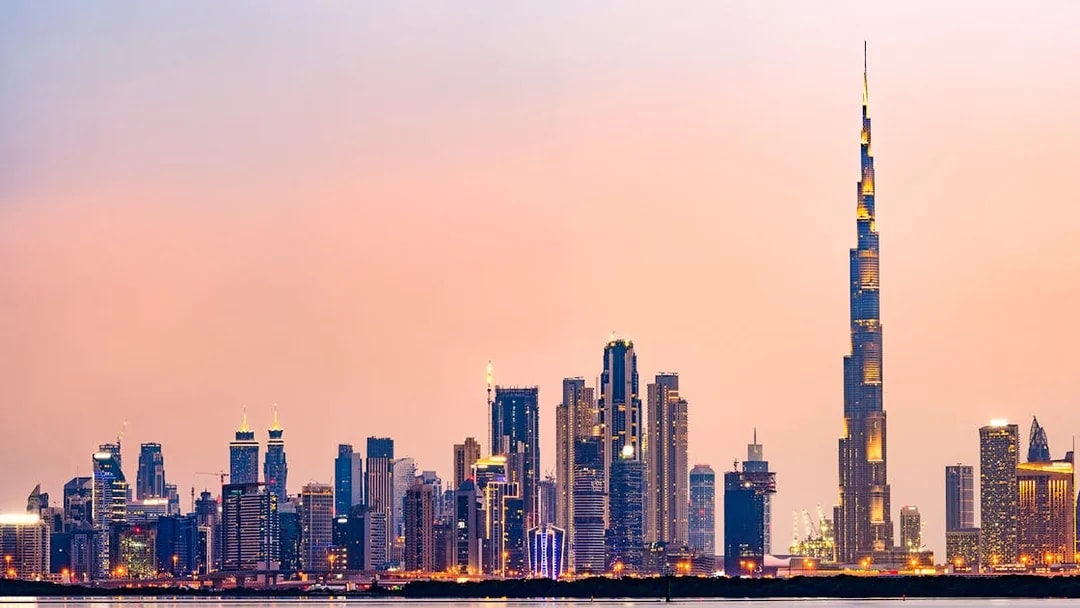 Dubai skyline with Burj Khalifa at sunset.