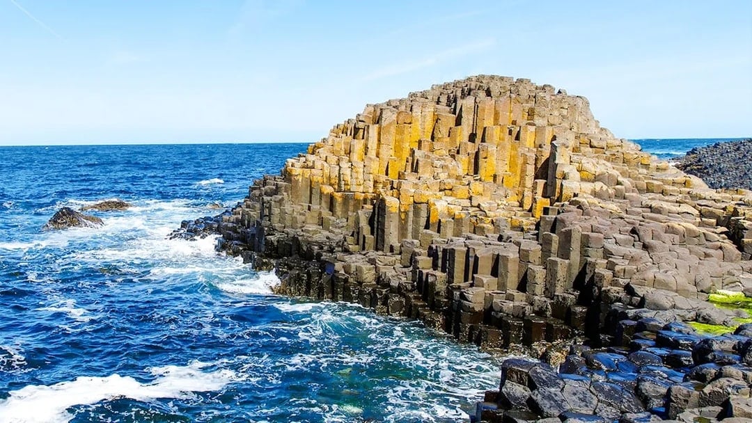 Giant's Causeway basalt columns by the ocean in Northern Ireland.