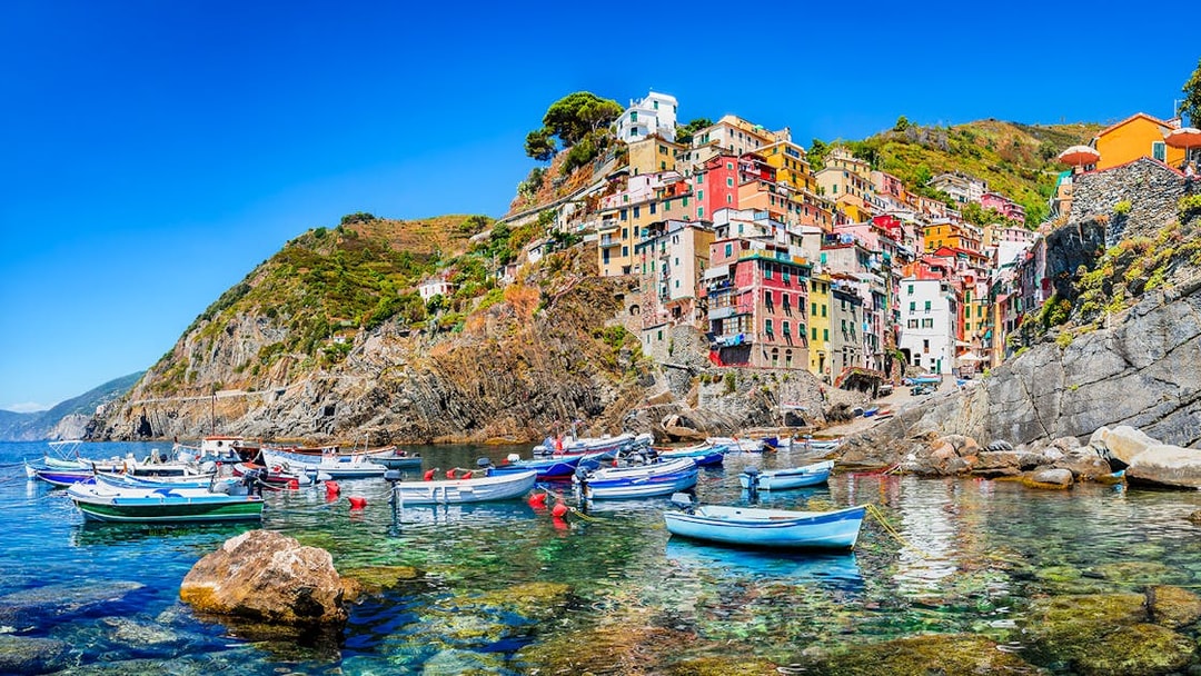 Colorful buildings and boats in Riomaggiore, Cinque Terre, Italy.