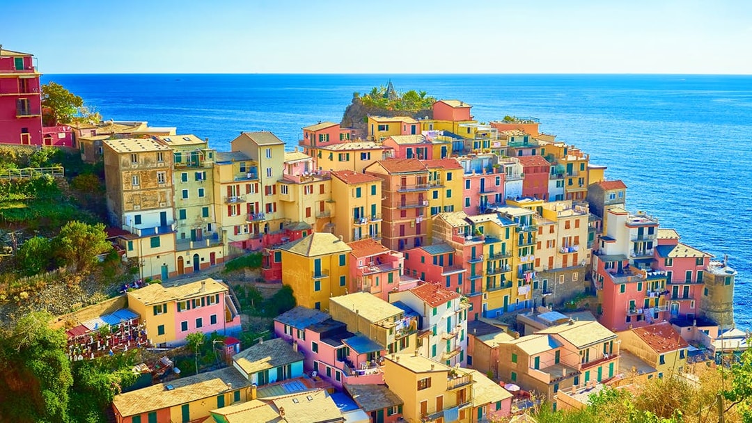 Colorful buildings in Manarola, Cinque Terre, overlooking the sea on a guided tour from Florence.