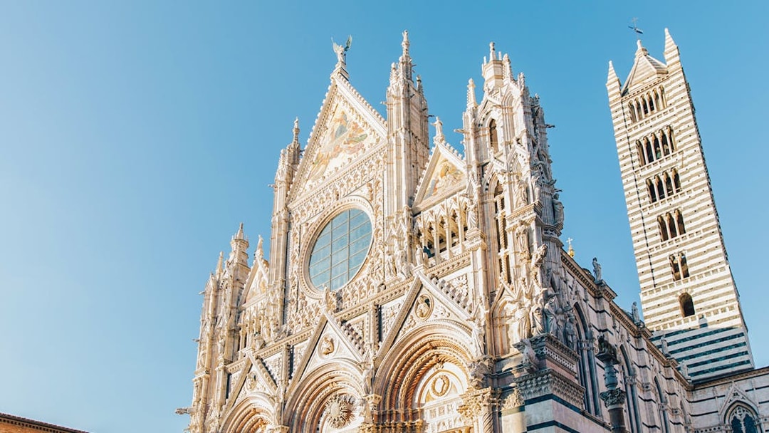 Siena Cathedral facade with intricate Gothic architecture, Tuscany.