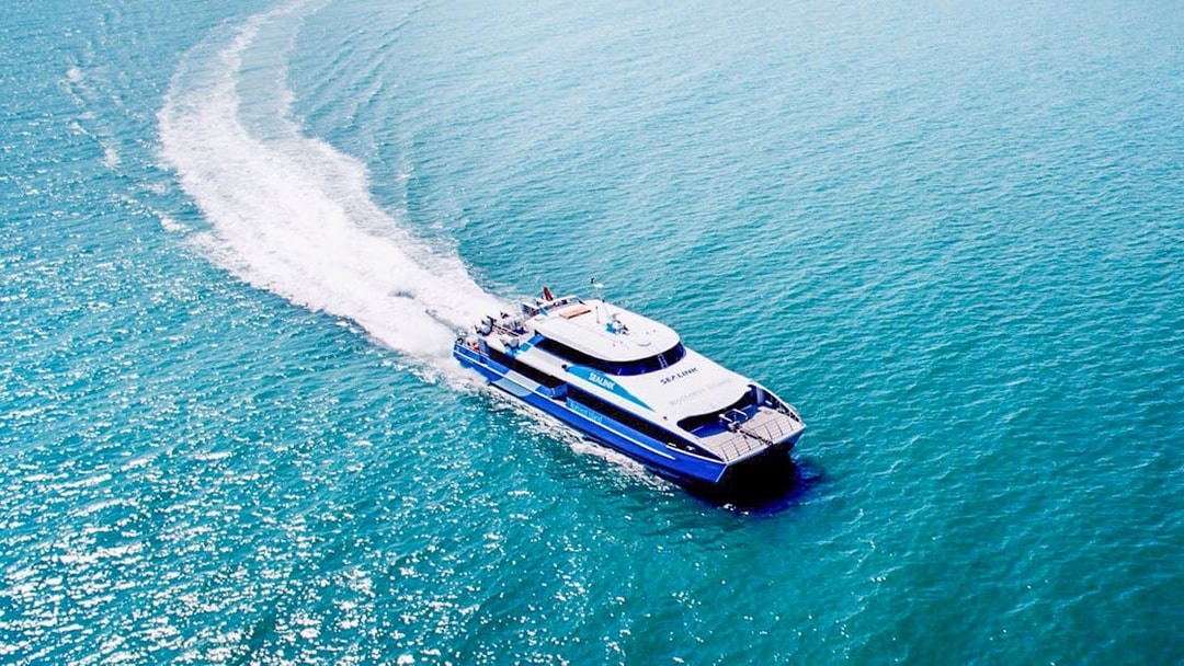 Ferry departing Rottnest Island towards Perth or Fremantle across the ocean.