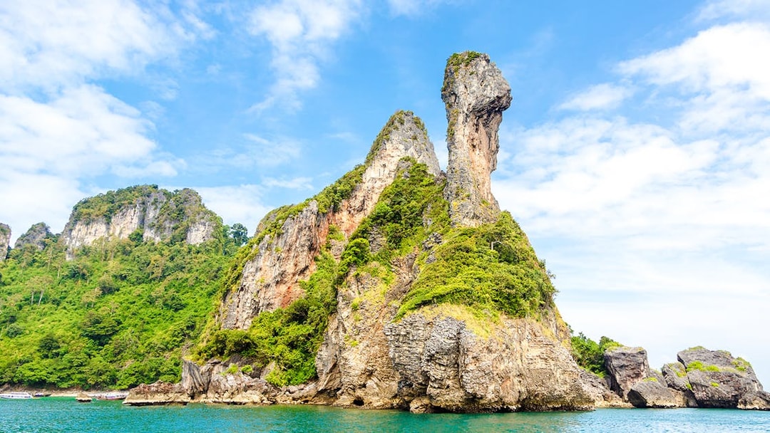 Chicken Island's unique rock formation in Krabi, Thailand, surrounded by turquoise waters.
