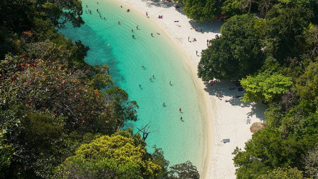 Aerial view of Hong Island beach with turquoise water and lush greenery, Krabi day trip.