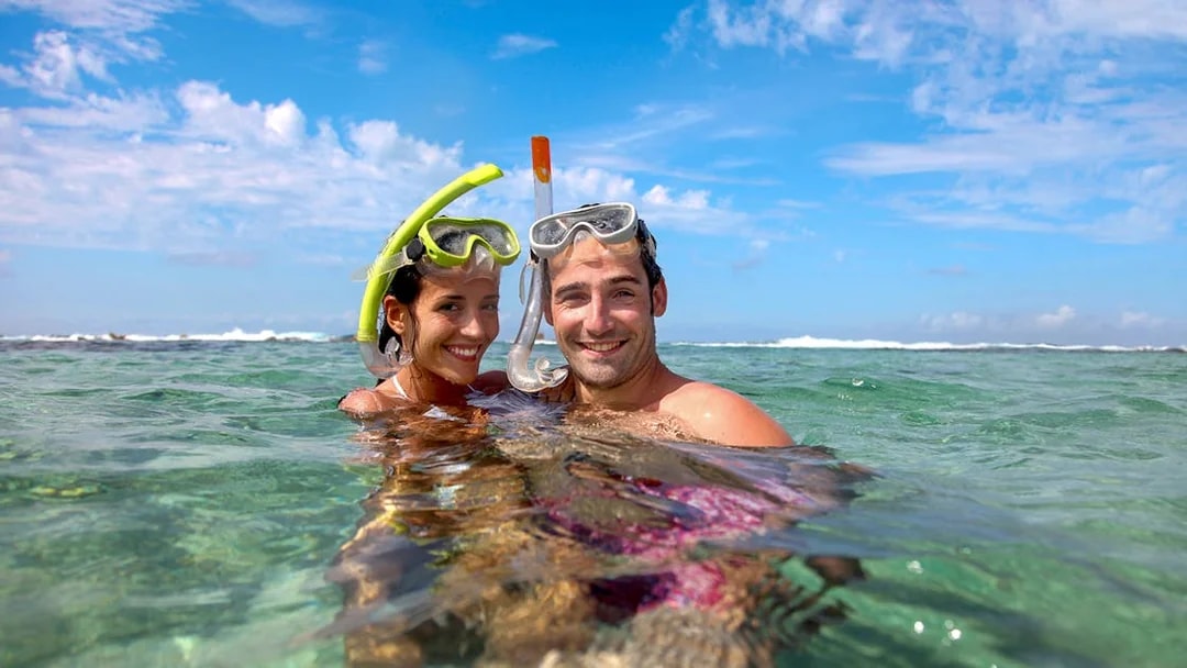 Snorkelers enjoying clear waters on Krabi Hong Island day trip by speed boat.
