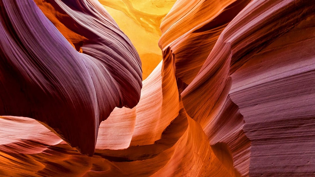 Aerial view of Antelope Canyon's swirling sandstone formations during a tour over Arizona.