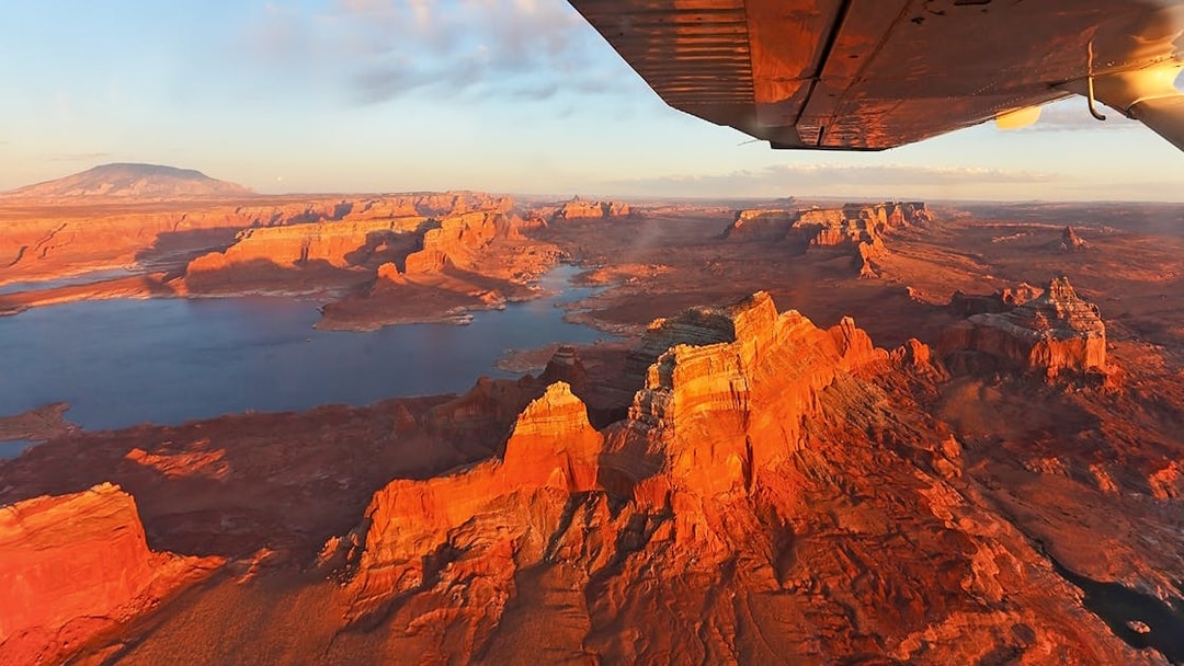 Aerial view of Antelope Canyon and Horseshoe Bend from an airplane during a scenic tour.