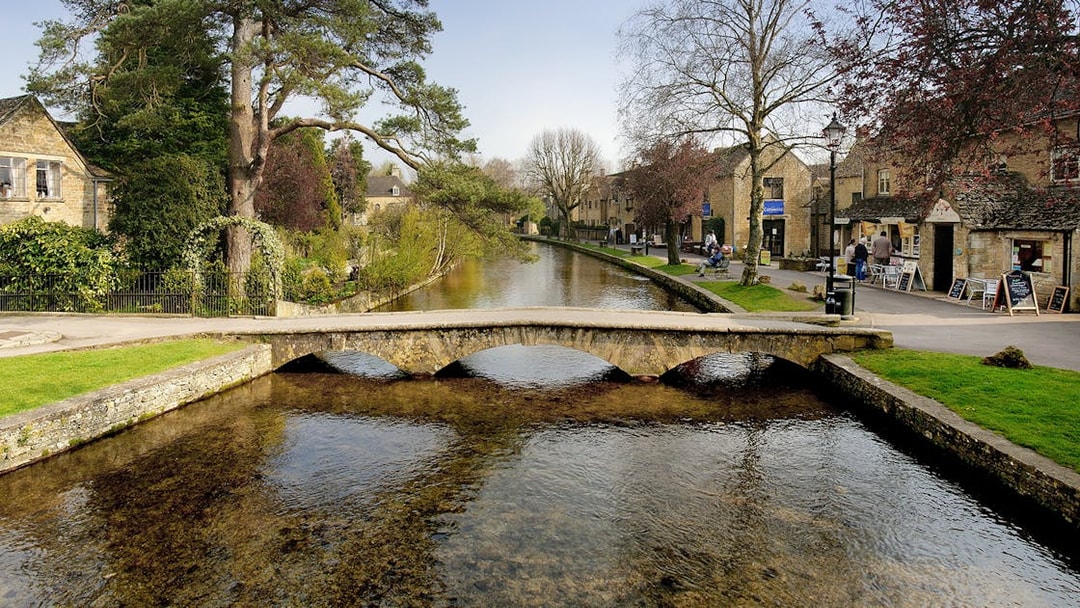 Quaint stone bridge over a river in Bourton-on-the-Water, England.