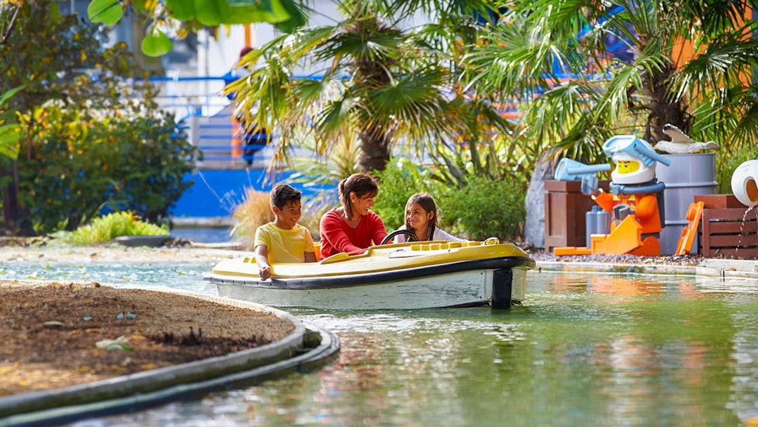 Family enjoying a boat ride at LEGOLAND Windsor Resort.