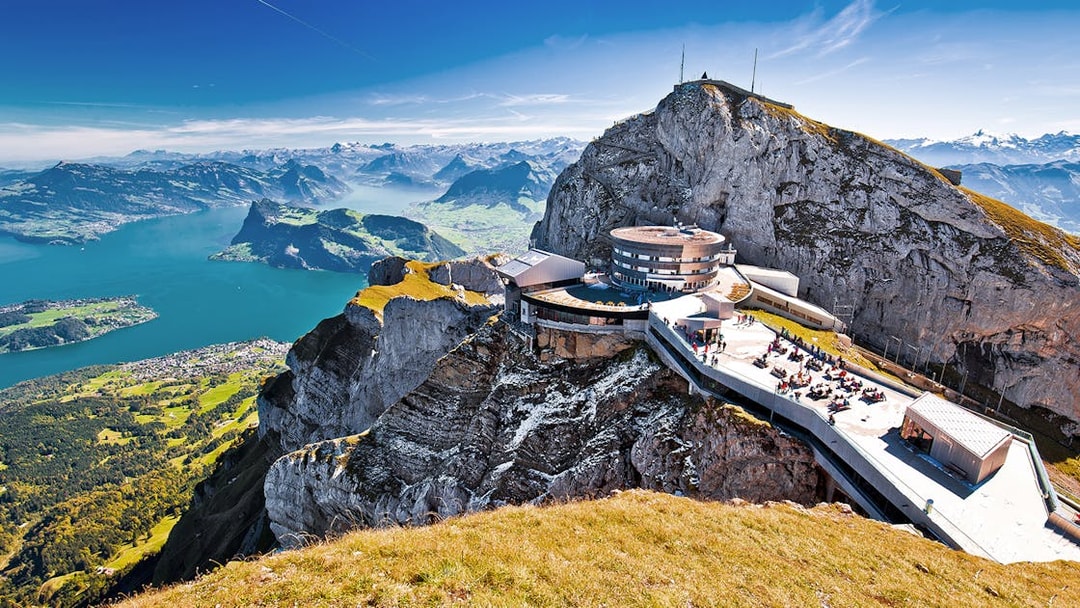 Mount Pilatus summit with panoramic view of Lake Lucerne and surrounding Alps.