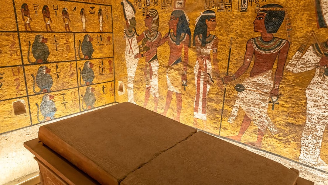 Tomb interior with ancient Egyptian wall paintings in the Valley of the Kings.