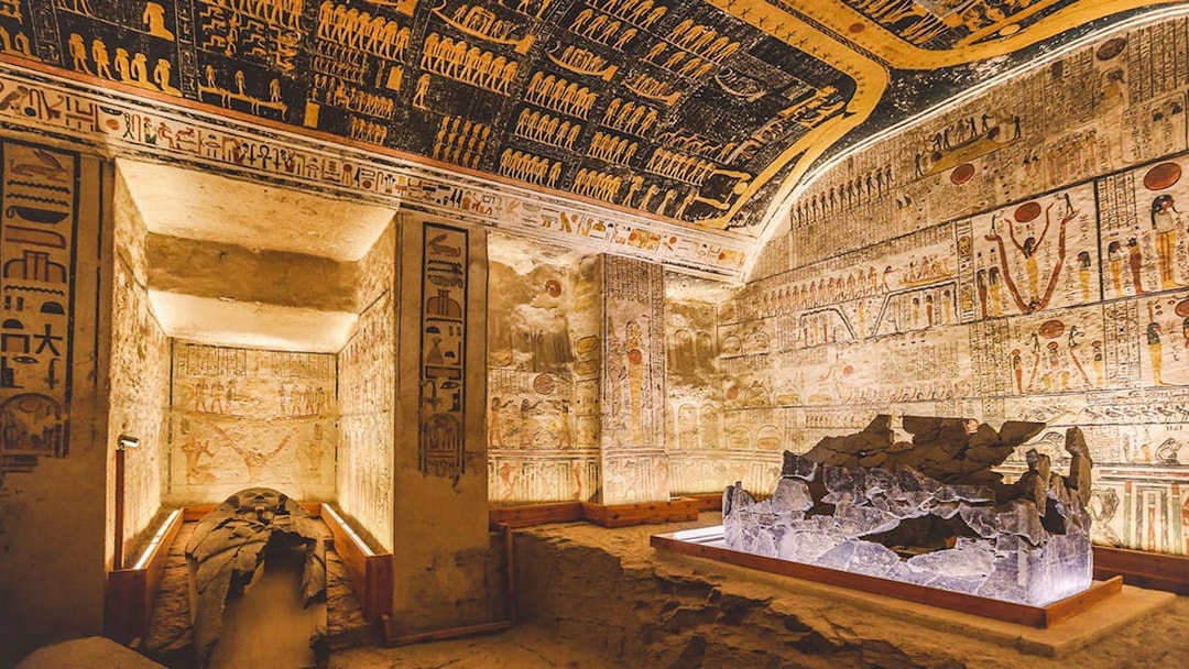 White stone sarcophagus in the Valley of the Kings tomb, Luxor, Egypt, with hieroglyphs.