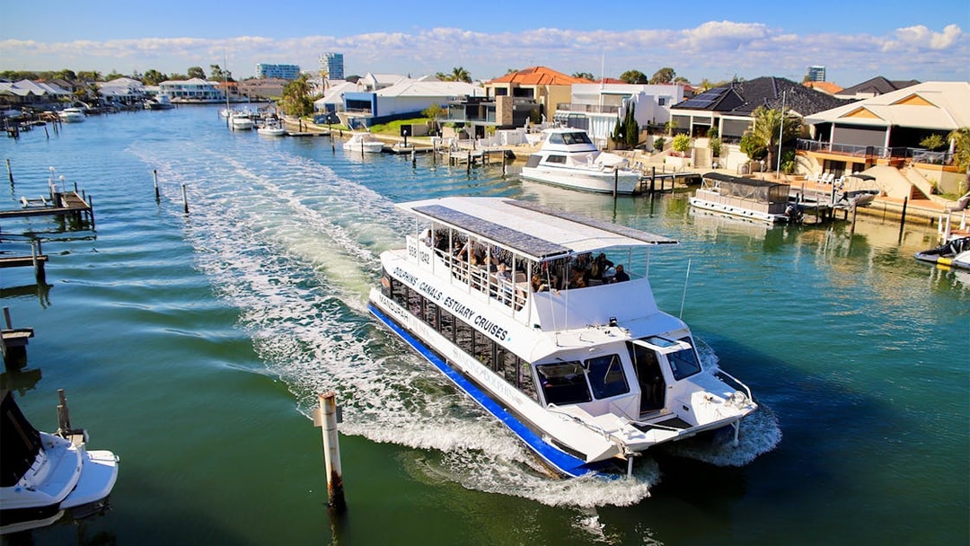 Tourists on a canal cruise boat in Mandurah, Australia.