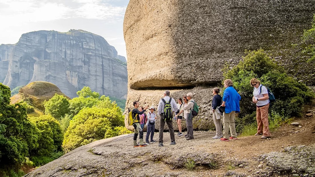 Guests hiking near rock formations during Meteora Hiking Tour with Monastery Visit.