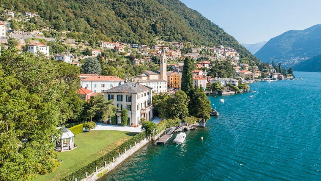 George Clooney's residence on Lake Como, Italy, with scenic waterfront and hillside village.
