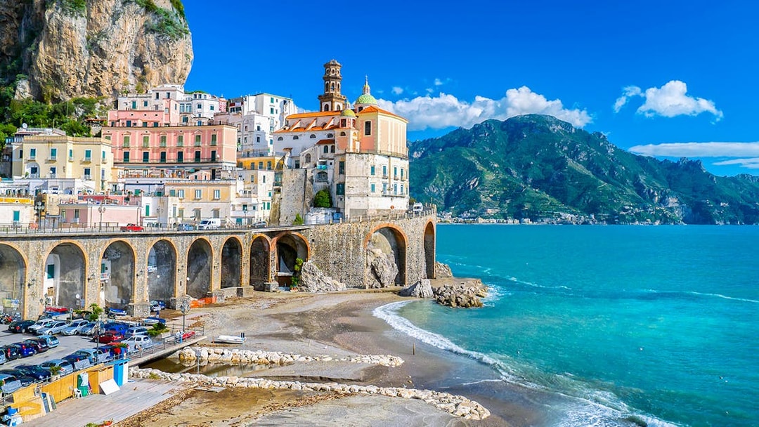 Positano coastal view with colorful buildings and cliffs on Amalfi Coast tour.
