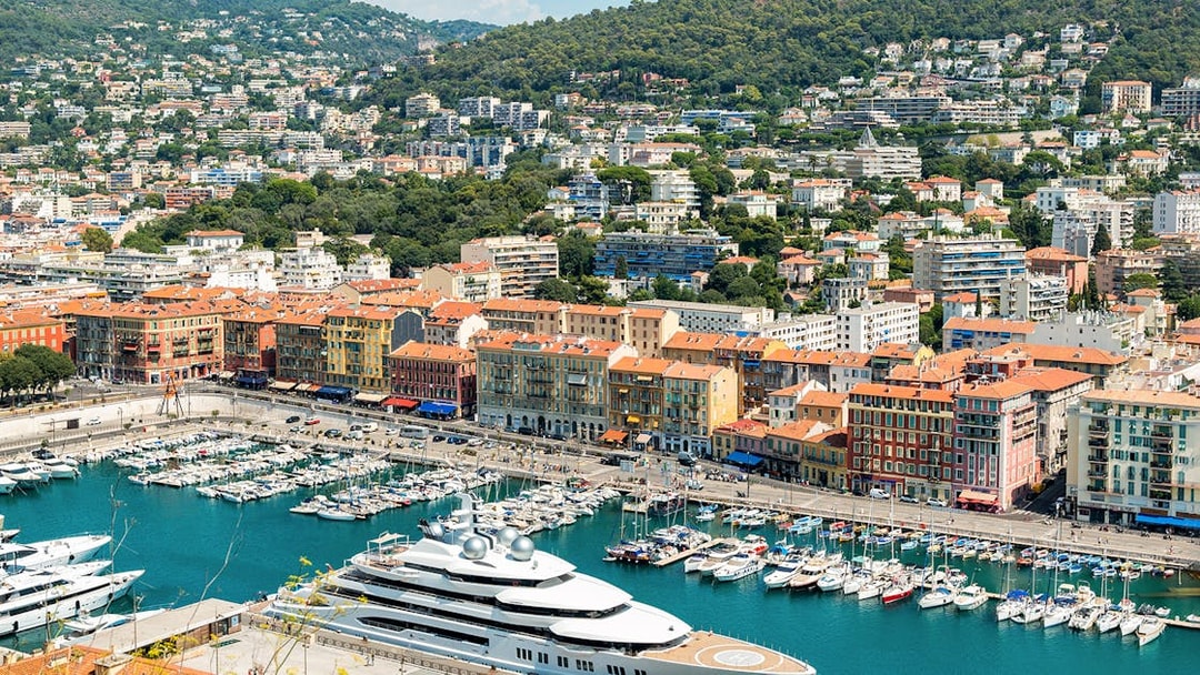 Harbor view in Nice, France with colorful buildings and yachts, part of Provence in One Day tour.