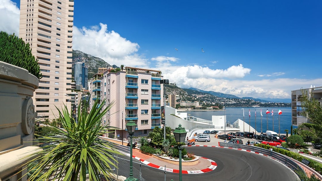Monte Carlo F1 circuit with cityscape and harbor in Monaco.