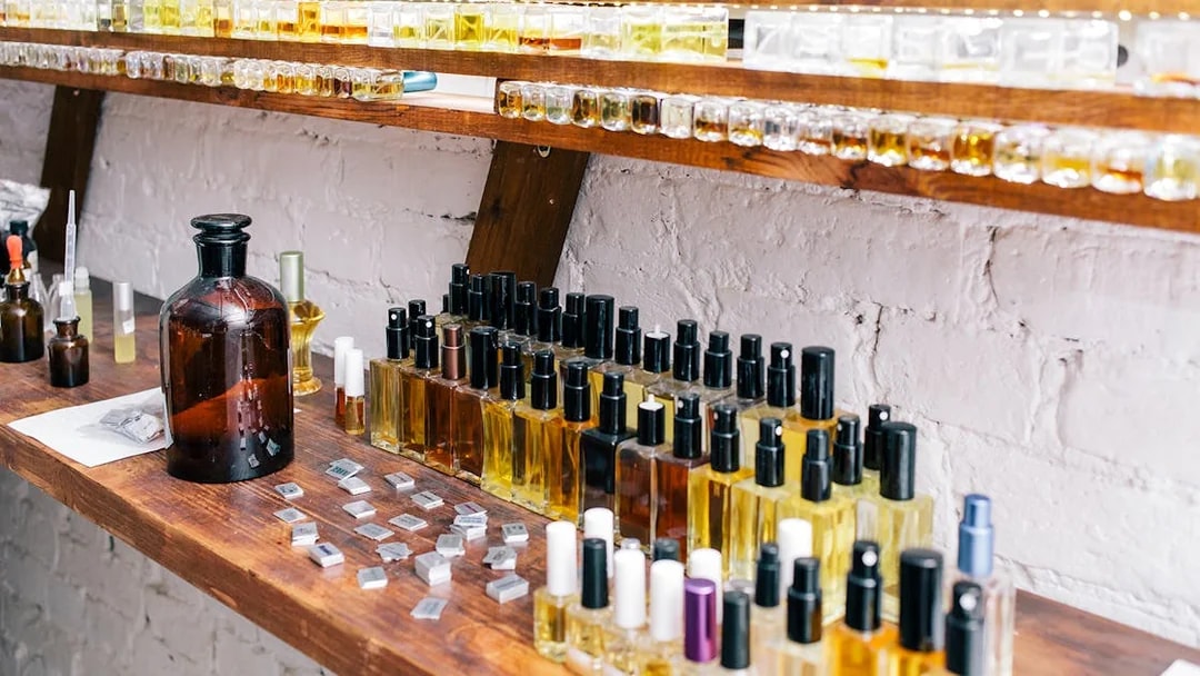 Perfume bottles on display at a fragrance shop in Eze, France.