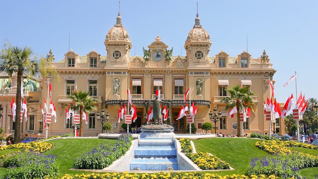 Monaco Casino with gardens and fountain, viewed from Nice.