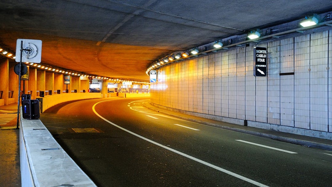 Monte Carlo tunnel illuminated at night during guided tour from Nice.