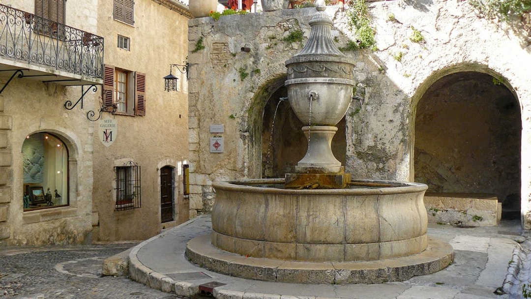 Stone fountain in a quaint street of Saint Paul de Vence, France.