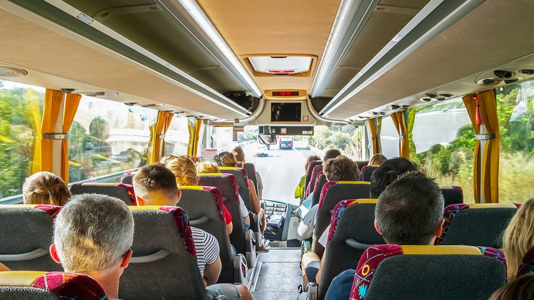 Tourists on a bus heading to Cinque Terre from Florence.