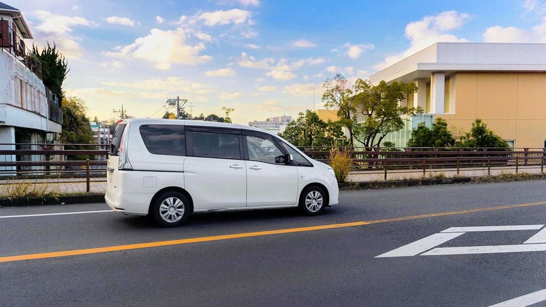 White van on a road, part of the St Tropez & Port Grimaud Day Tour from Nice.