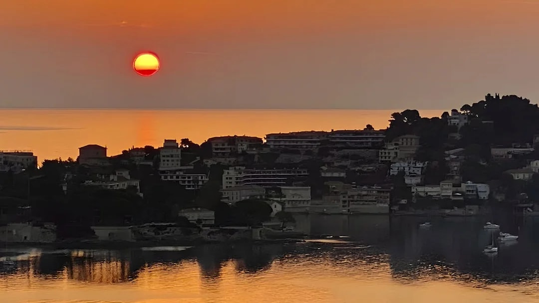 Sunset view over St Jean Cap Ferrat from a boat tour departing Nice.