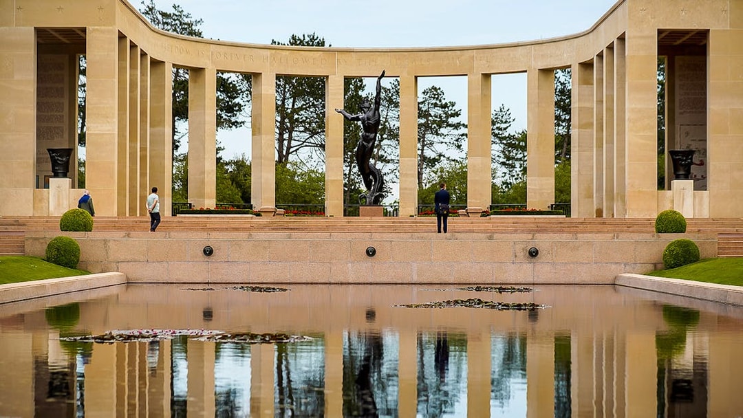 Normandy American Cemetery memorial with reflecting pool on D-Day beaches day trip.
