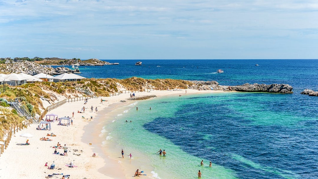People enjoying the sun and sea at Pinky Beach, Rottnest Island.