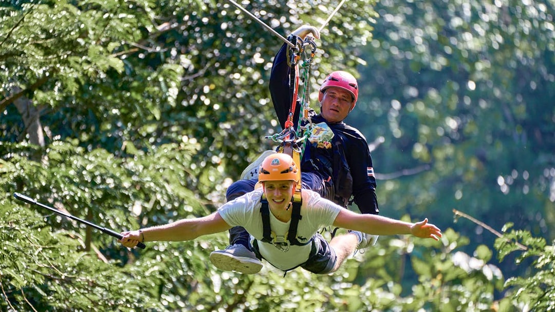 Ziplining through lush forest at Erawan Patong Seaview, Phuket.