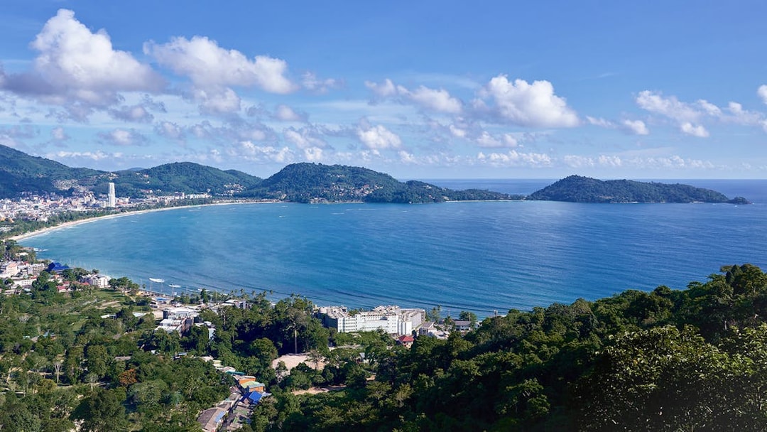 Phuket's Patong Bay view from Erawan Patong Seaview Zipline, lush hills and coastline.