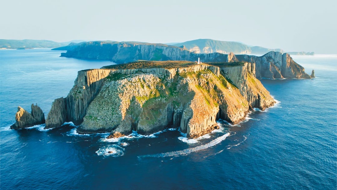 Tasman Island's rugged cliffs and ocean view on a wilderness cruise.