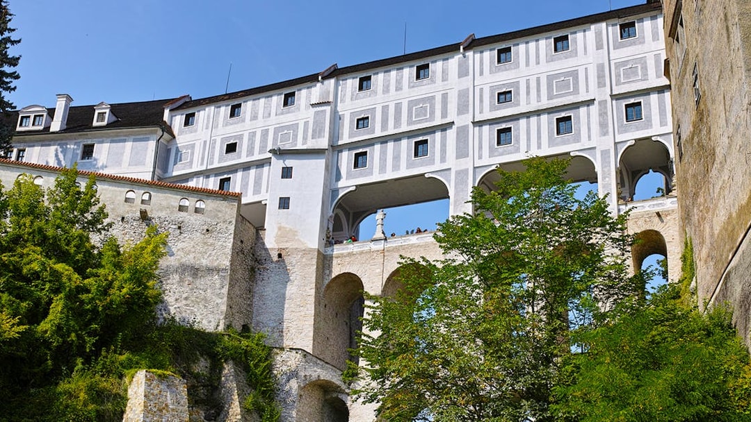 Cloak Bridge arches and facade in Cesky Krumlov, Czech Republic.