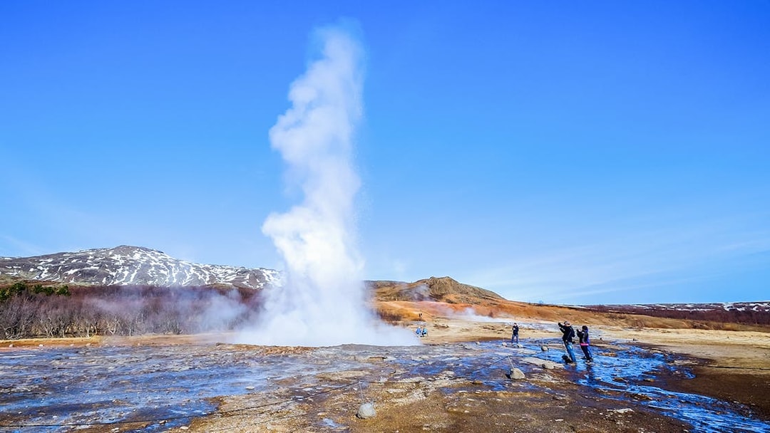 Geyser erupting in Haukadalur Valley, part of Iceland's Golden Circle Tour.