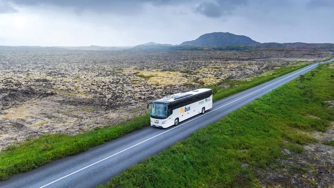 Bus traveling through Icelandic landscape en route to Blue Lagoon from Reykjavik/Keflavík Airport.