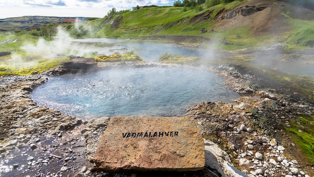 Geothermal pool with steam rising, Golden Circle tour, Iceland.