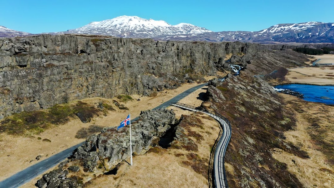 Aerial view of Thingvellir National Park with Icelandic flag, part of the Golden Circle near Reykjavik.