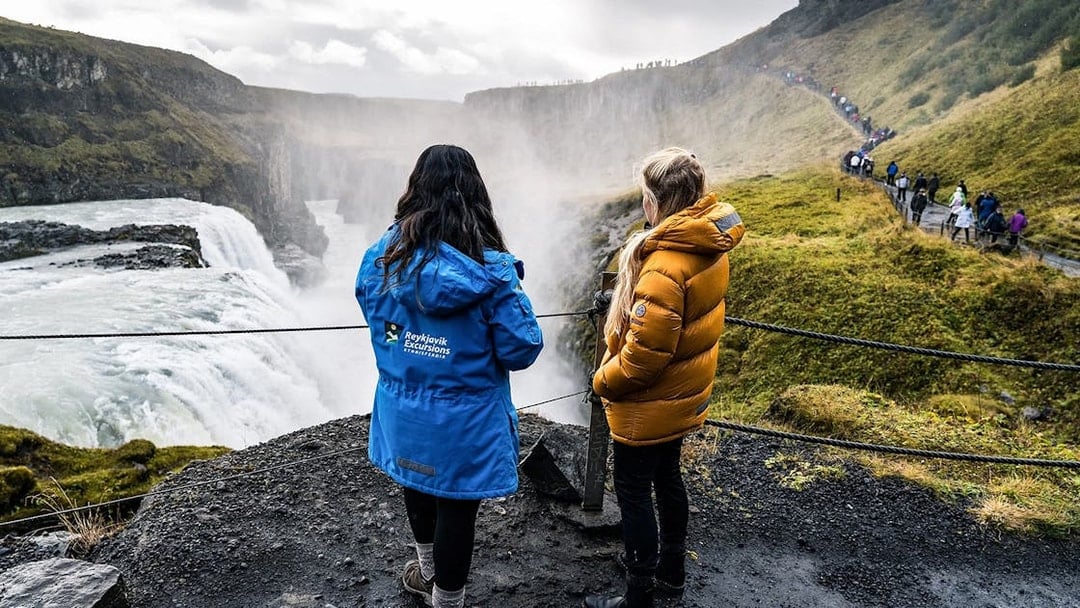 Tourists viewing Gullfoss Falls on Golden Circle day trip, Iceland.