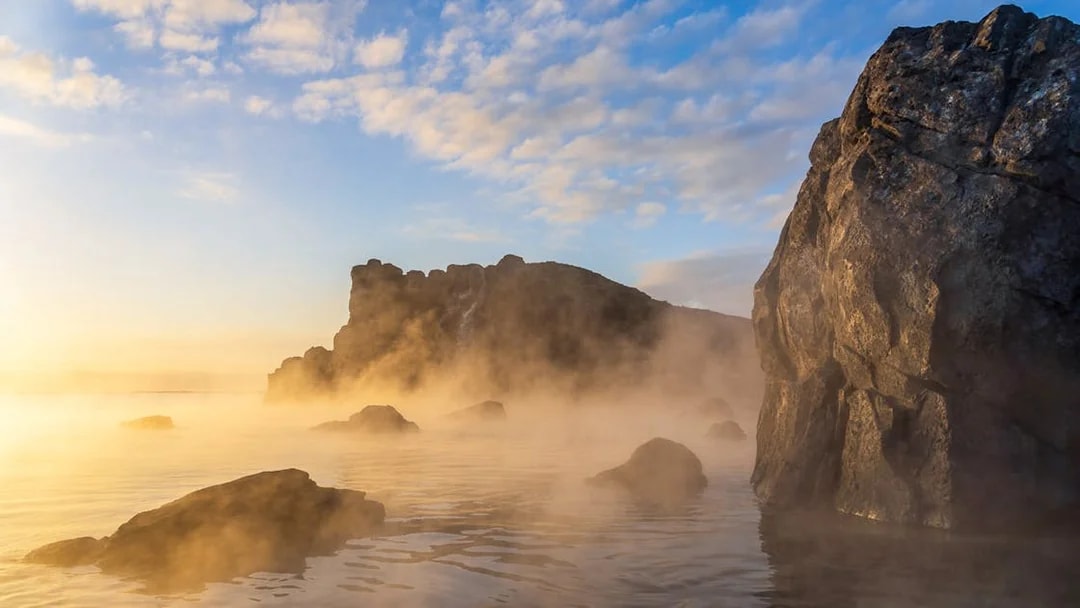 Sky Lagoon with misty rocks and water at sunrise, Saman Pass.