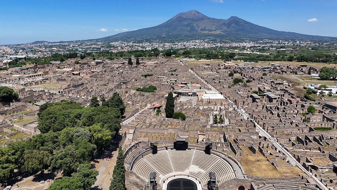 Aerial view of Pompeii Ruins with Mount Vesuvius in the background, Naples.
